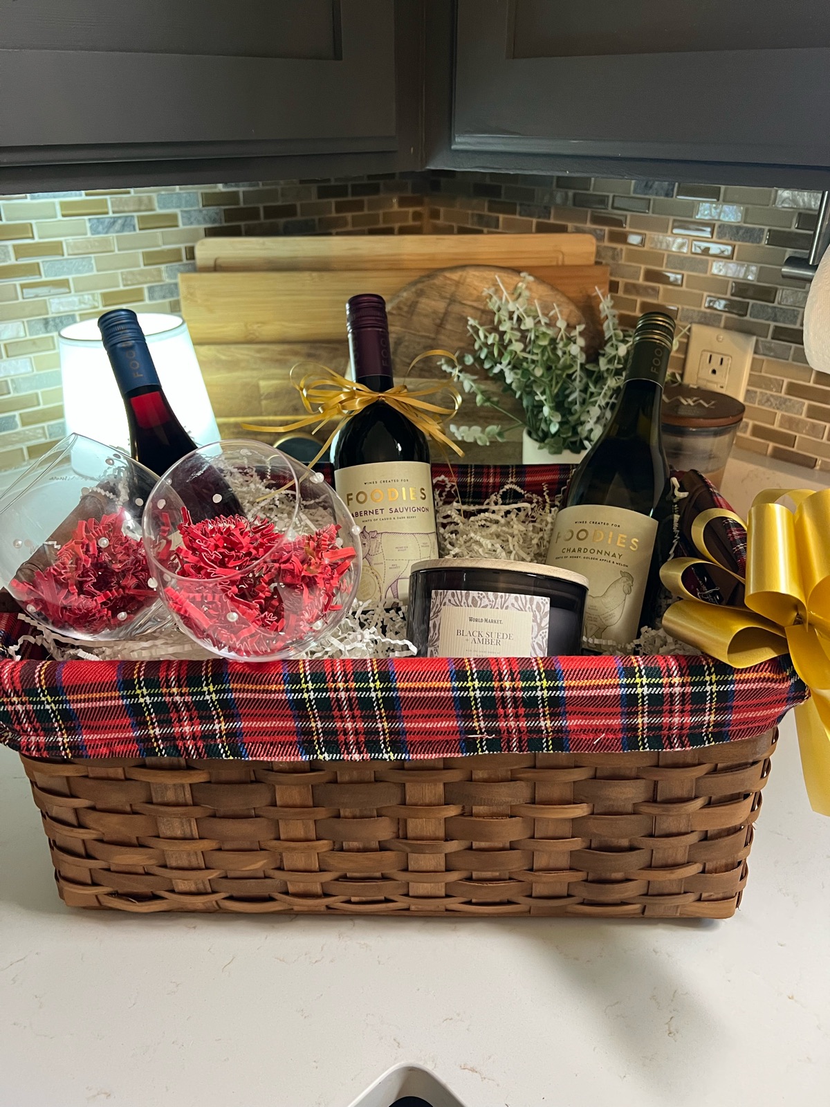 Holiday basket with wine, glasses and candle