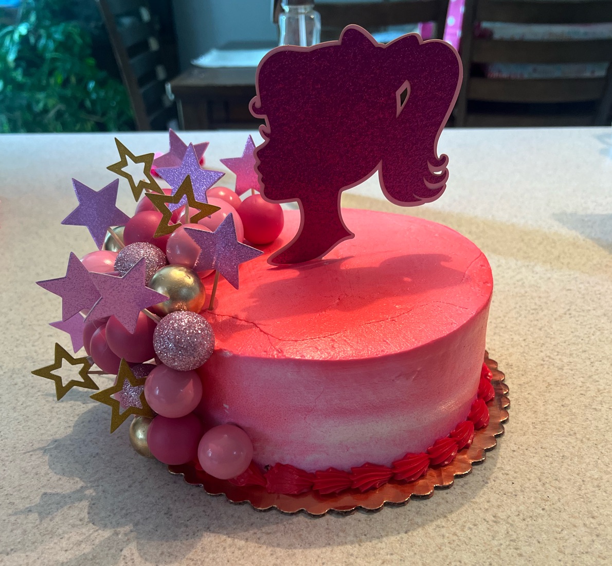 Pink ombre cake with a silhouette topper, glitter stars and pink and gold pearls